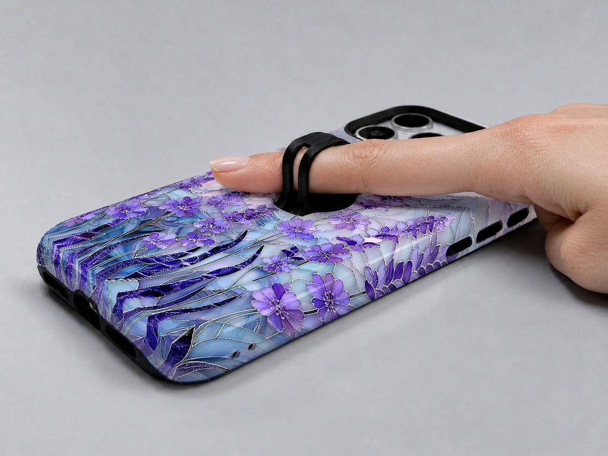 Purple Wisteria Garden MagSafe Loop iPhone Case shown in use with a finger through the horizontal loop