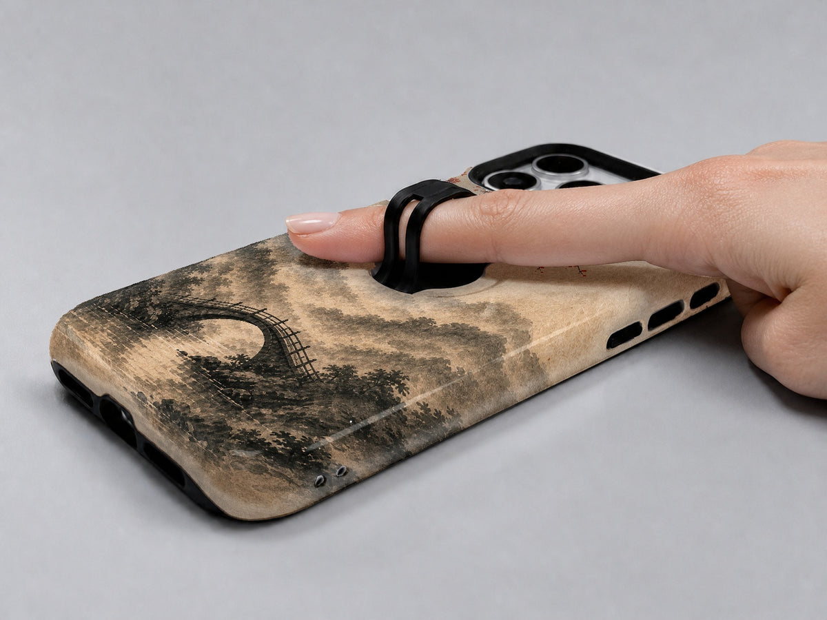 Red Sun Mountain Bridge MagSafe Loop iPhone Case shown in use with a finger through the horizontal loop
