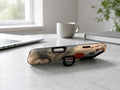 Red Sun Mountain Bridge MagSafe Loop iPhone Case shown in a neutral white professional lifestyle setting