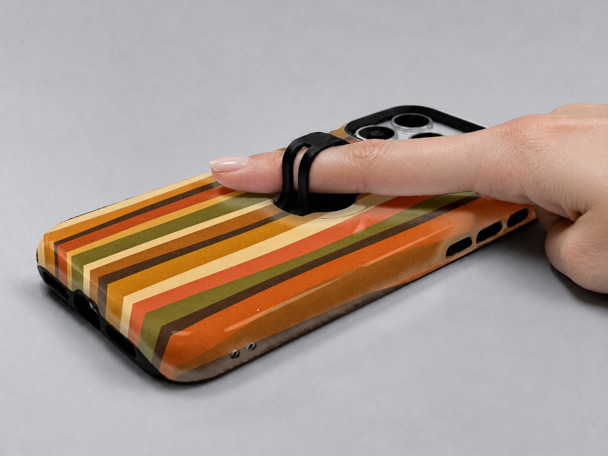 Retro Sunset Stripe MagSafe Loop iPhone Case shown in use with a finger through the horizontal loop