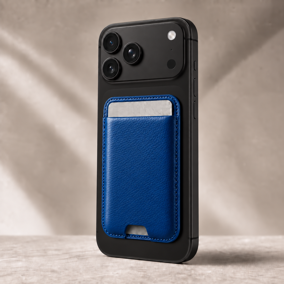 Royal Blue MagSafe card holder attached to a phone for everyday carry