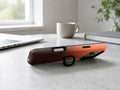Rust Brown Ombre Gradient MagSafe Loop iPhone Case shown in a neutral white professional lifestyle setting