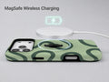 Sage Green Retro Swirl MagSafe Loop iPhone Case shown with a MagSafe-compatible wireless charger attached