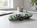 Sage Green Retro Swirl MagSafe Loop iPhone Case shown in a neutral white professional lifestyle setting