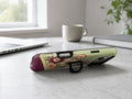 Sage Retro Folk Floral MagSafe Loop iPhone Case shown in a neutral white professional lifestyle setting