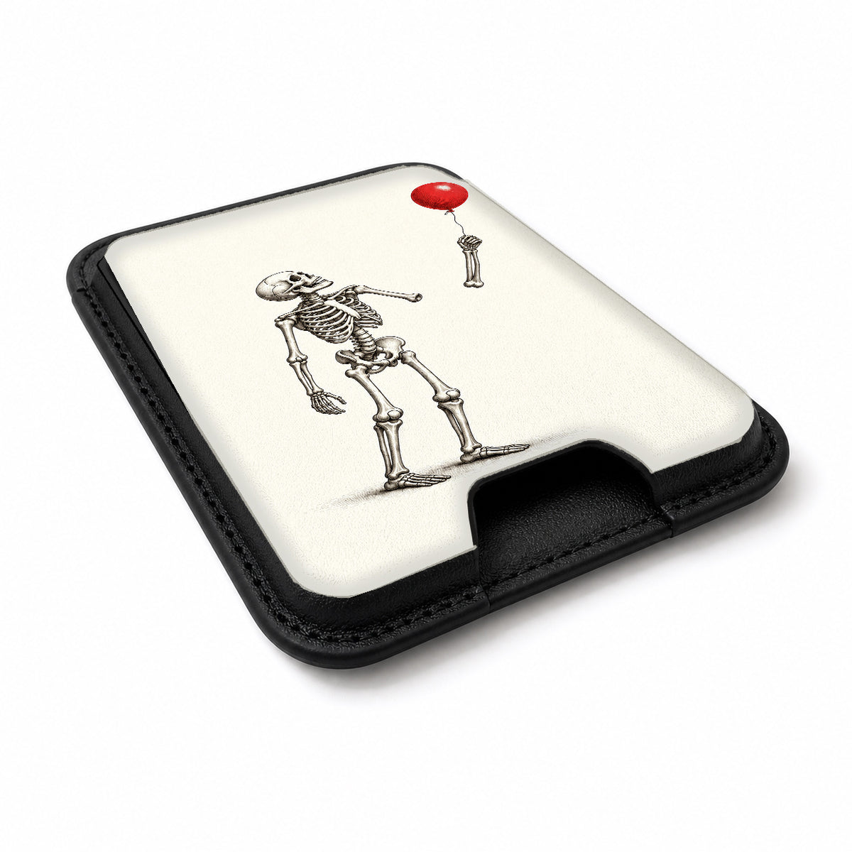 Skeleton with Red Balloon MagSafe Card Holder, angled view showing the thumb access opening
