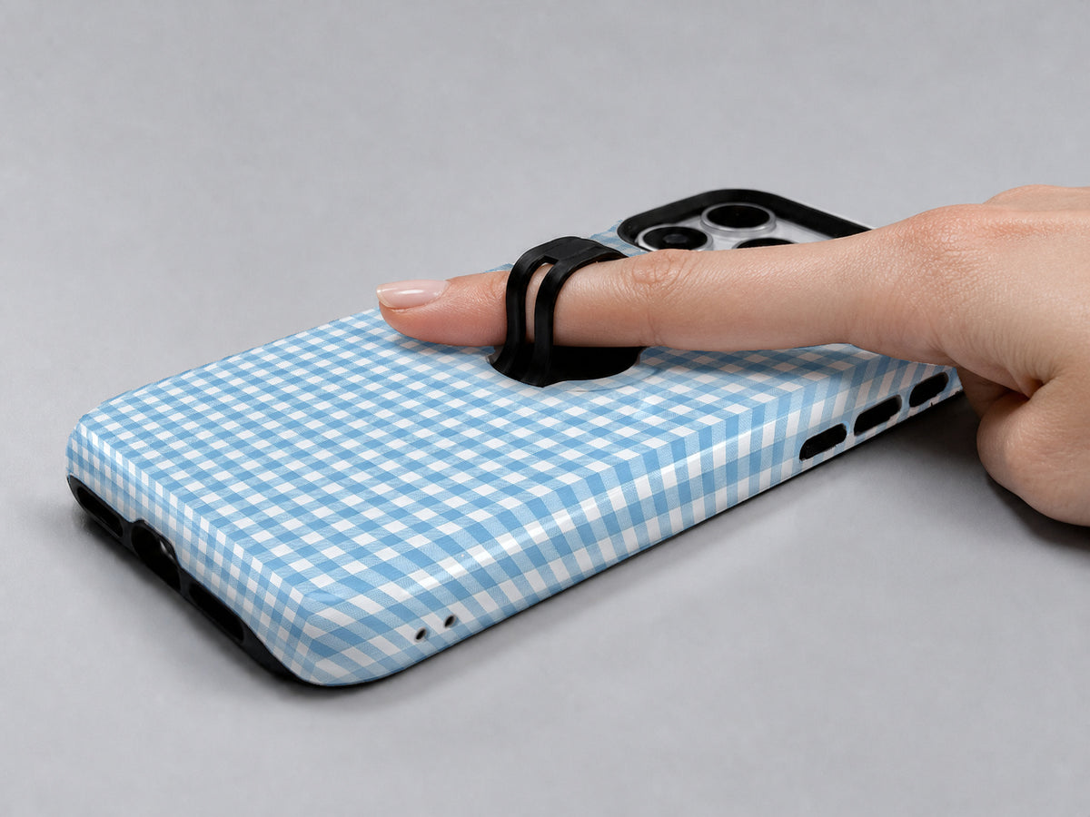 Sky Blue and White Gingham MagSafe Loop Case, shown with a finger through the loop