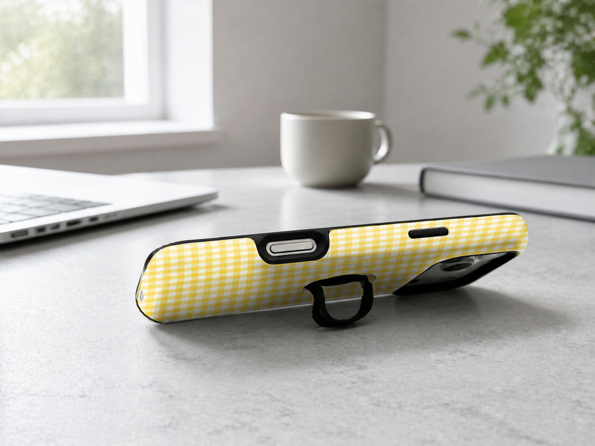 Sunflower Yellow and White Gingham MagSafe Loop Case, shown as a hands-free kickstand