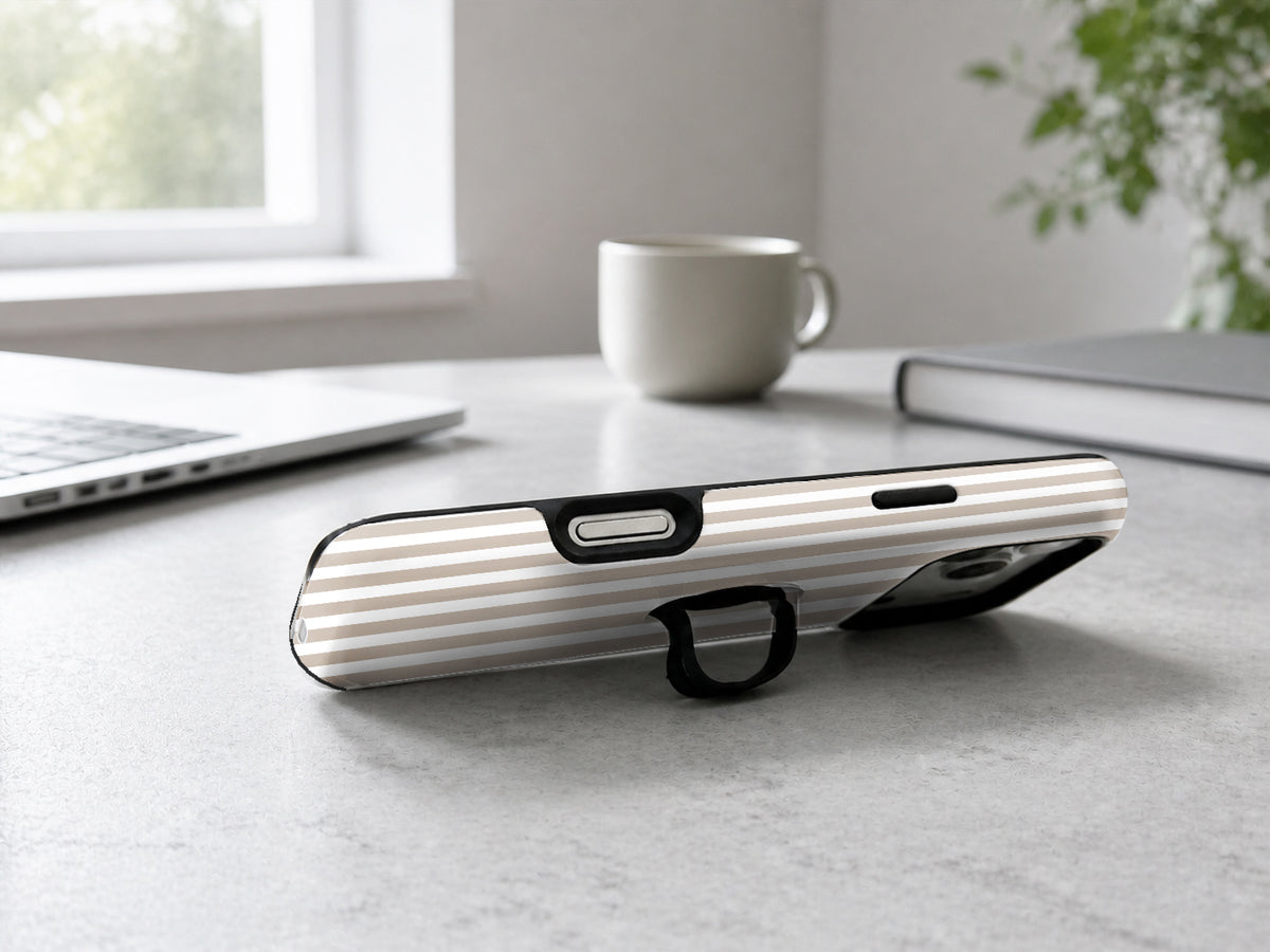 Taupe Pinstripe MagSafe Loop iPhone Case shown in a neutral white professional lifestyle setting