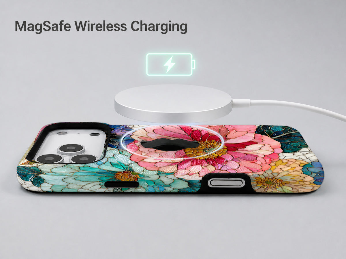 Teal Pink Stained Glass Floral MagSafe Loop iPhone Case shown with a MagSafe-compatible wireless charger attached