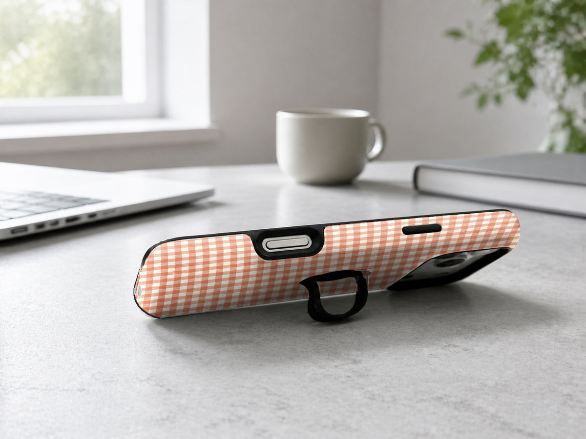 Terracotta Orange and White Gingham MagSafe Loop Case, shown as a hands-free kickstand