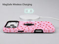 Tiny Red Hearts MagSafe Loop iPhone Case shown with a MagSafe-compatible wireless charger attached