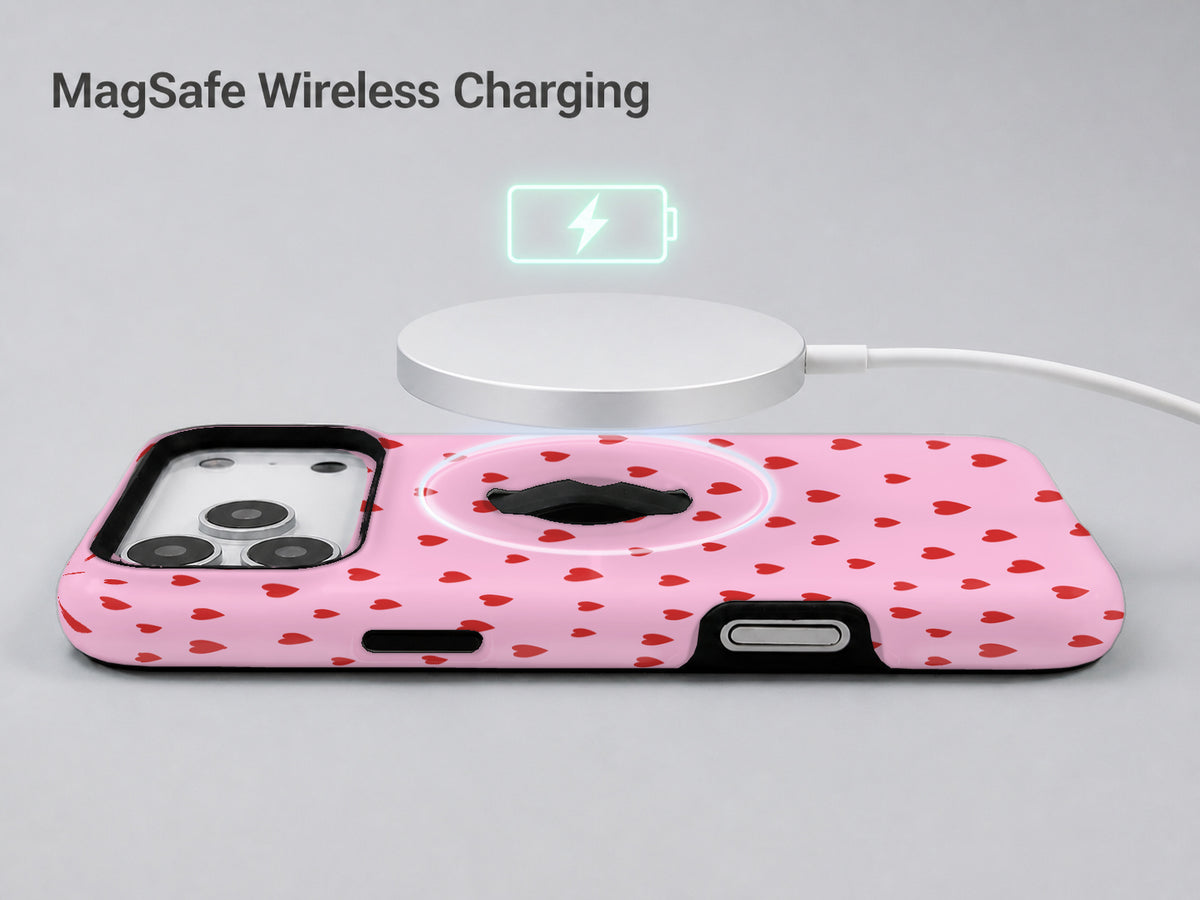Tiny Red Hearts MagSafe Loop iPhone Case shown with a MagSafe-compatible wireless charger attached