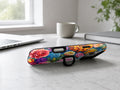 Vibrant Garden Floral Bouquet MagSafe Loop iPhone Case shown in a neutral white professional lifestyle setting