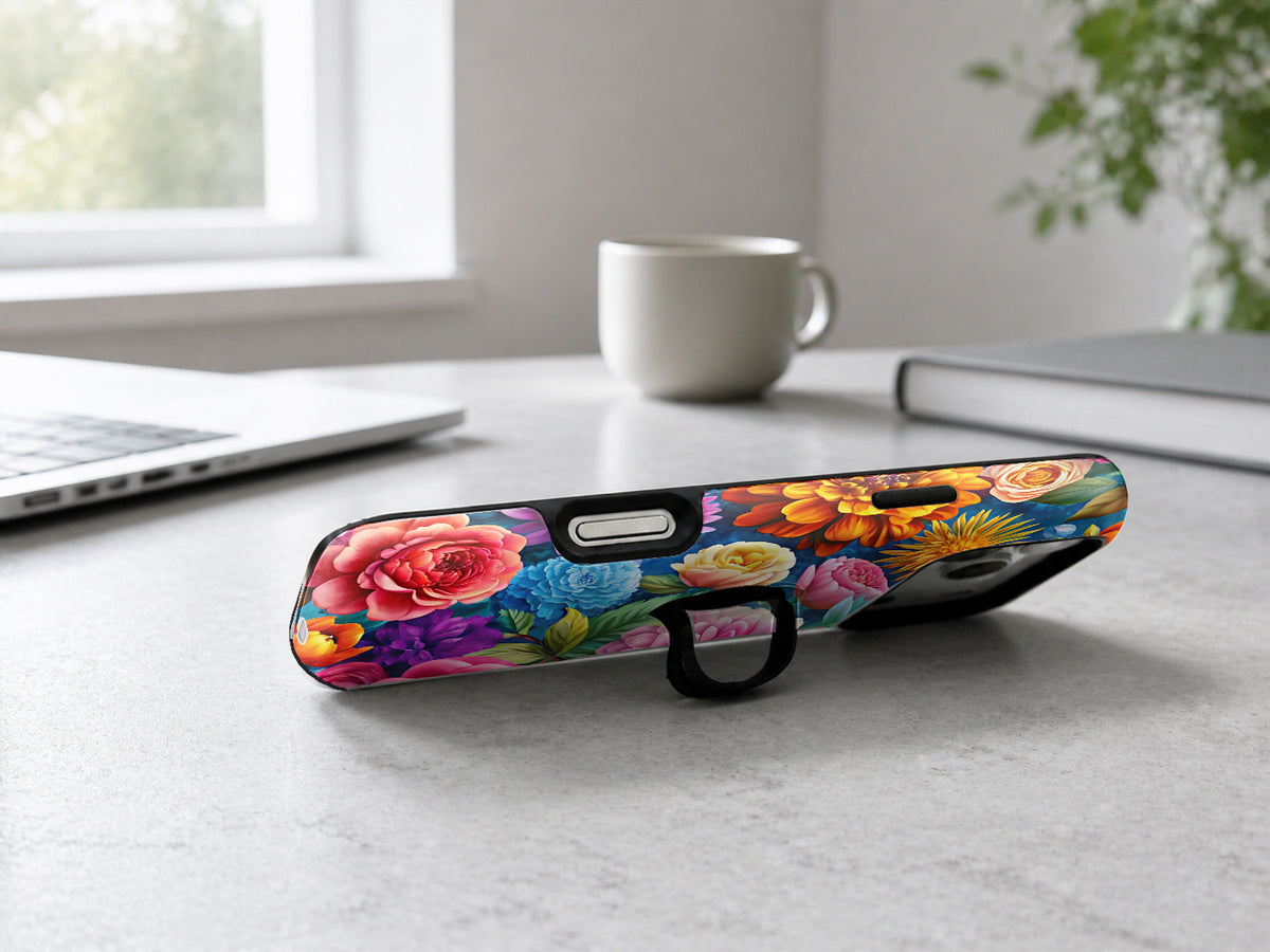 Vibrant Garden Floral Bouquet MagSafe Loop iPhone Case shown in a neutral white professional lifestyle setting