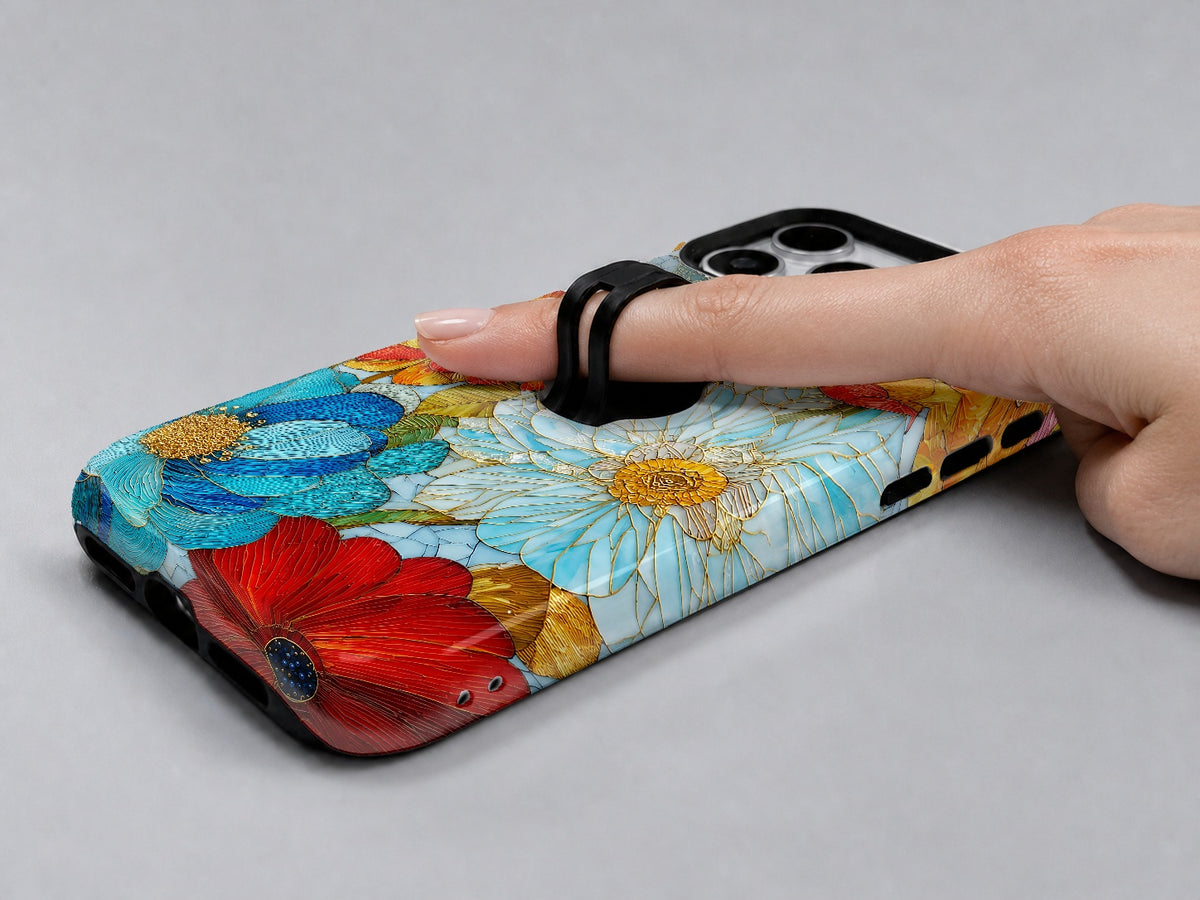 Vibrant Poppy Stained Glass MagSafe Loop iPhone Case shown in use with a finger through the horizontal loop