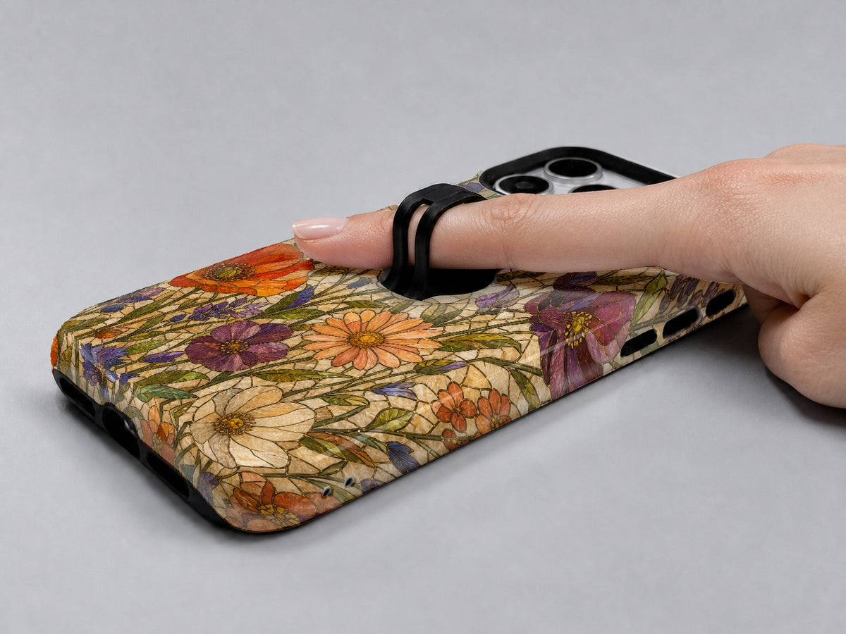 Vintage Autumn Wildflower MagSafe Loop iPhone Case shown in use with a finger through the horizontal loop