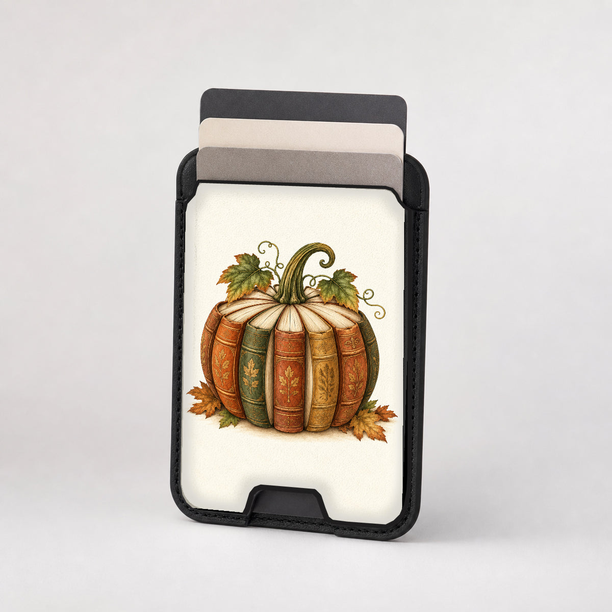 Vintage Book Pumpkin MagSafe Card Holder, card storage shown with cards