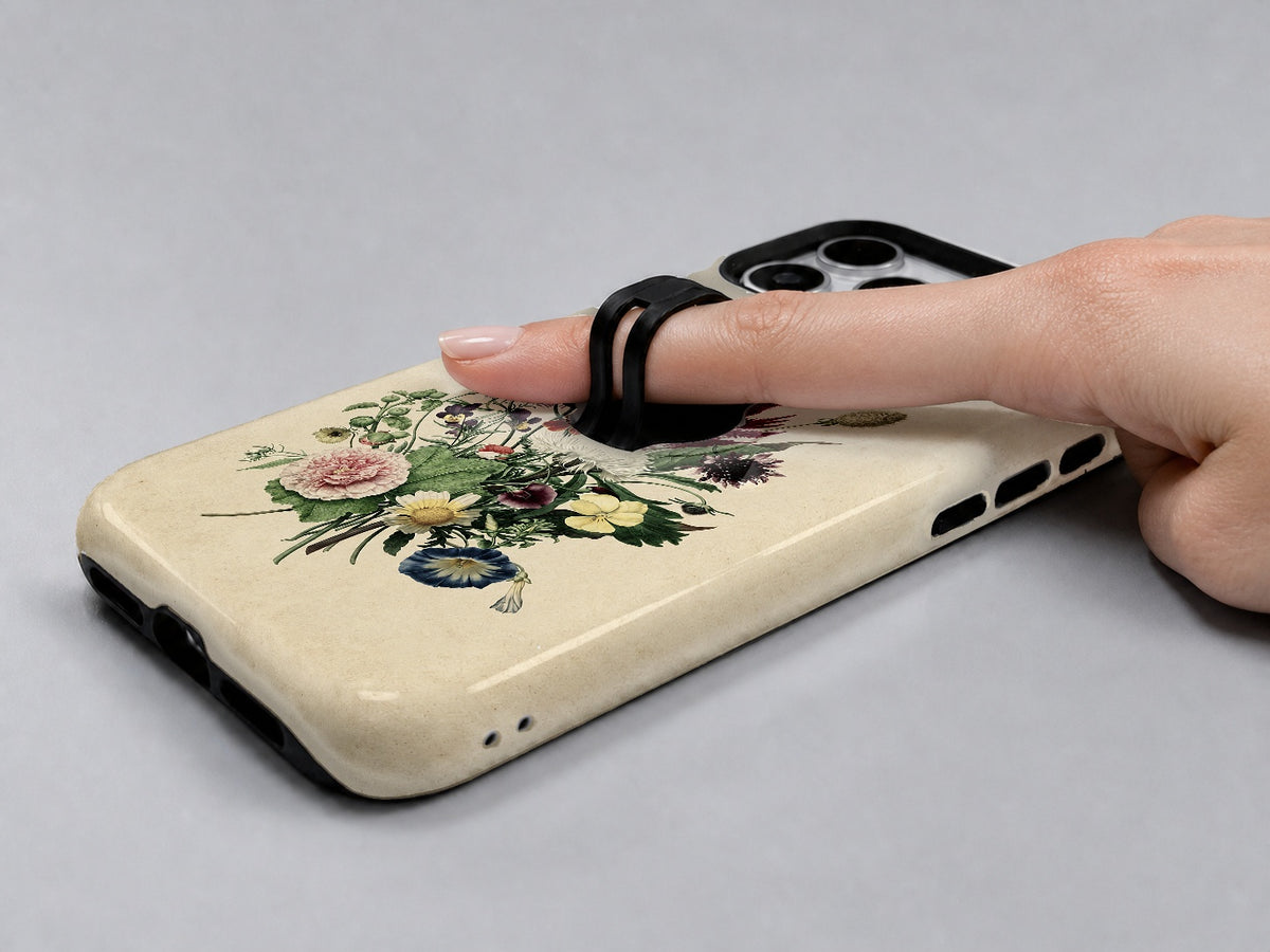 Vintage Botanical Bouquet MagSafe Loop iPhone Case shown in use with a finger through the horizontal loop
