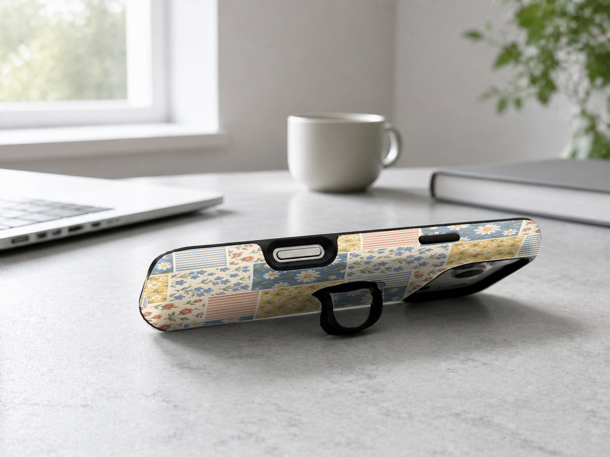 Blue and Yellow Daisy Floral Patchwork MagSafe Loop Case, shown as a hands-free kickstand