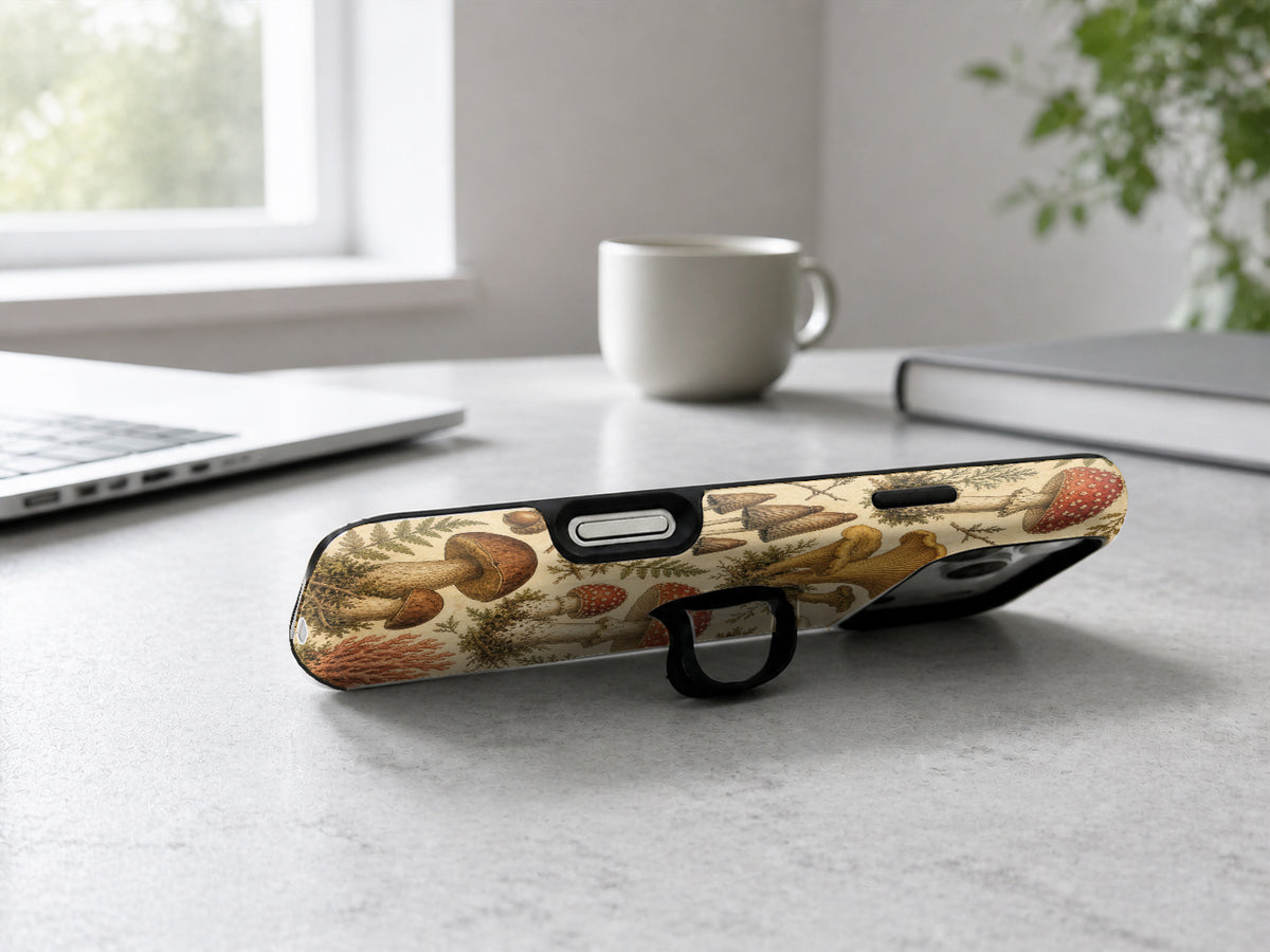 Vintage Mushroom Botanical MagSafe Loop iPhone Case shown in a neutral white professional lifestyle setting
