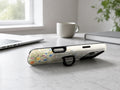 Vintage Wildflower Meadow MagSafe Loop iPhone Case shown in a neutral white professional lifestyle setting