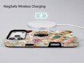 Warm Wildflower Stained Glass MagSafe Loop iPhone Case shown with a MagSafe-compatible wireless charger attached