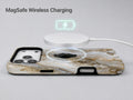 White Gold Agate Marble MagSafe Loop iPhone Case shown with a MagSafe-compatible wireless charger attached
