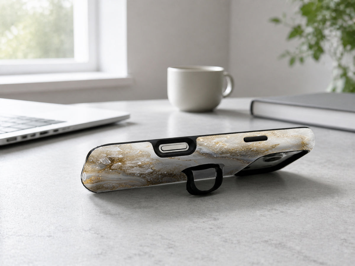 White Gold Agate Marble MagSafe Loop iPhone Case shown in a neutral white professional lifestyle setting