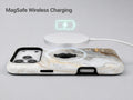 White Gold Marble MagSafe Loop iPhone Case shown with a MagSafe-compatible wireless charger attached