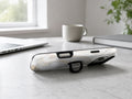 White Gold Marble MagSafe Loop iPhone Case shown in a neutral white professional lifestyle setting