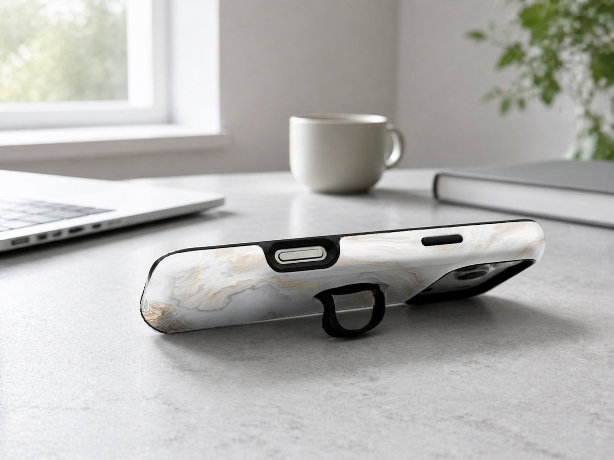 White Gold Marble MagSafe Loop iPhone Case shown in a neutral white professional lifestyle setting